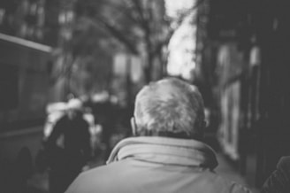 Artistic black and white street photography capturing a fleeting moment of daily life.