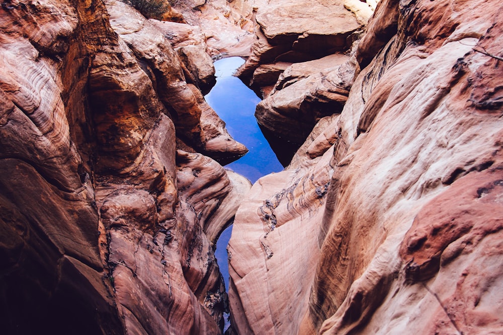 rocky mountain near body of water