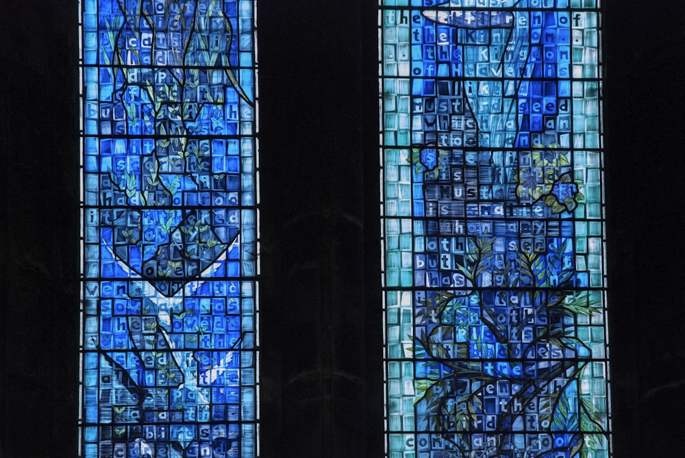 two stained glass windows in a church