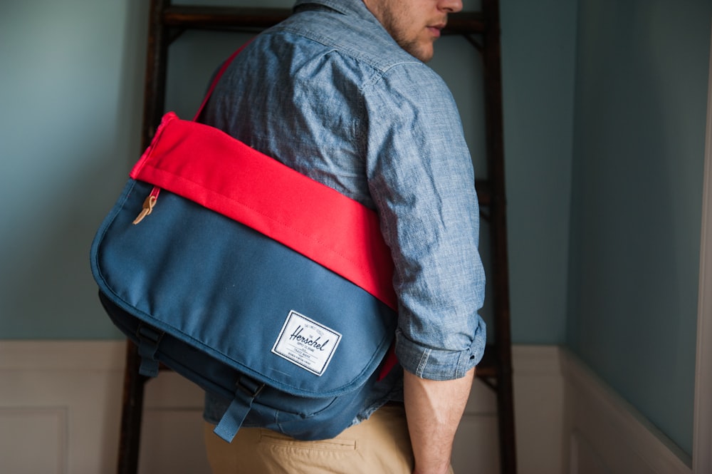 man carrying bag