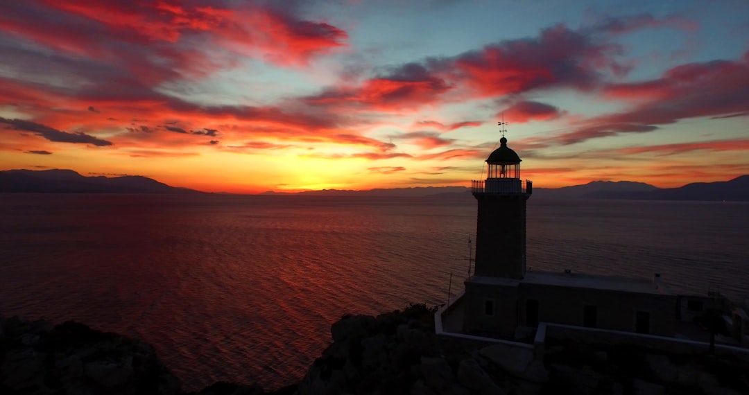 photo of lighthouse and a sunset