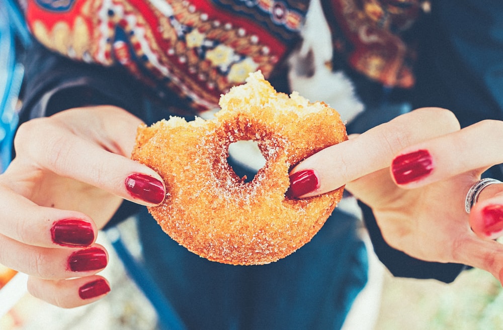 woman holding donut