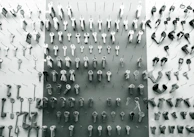 Rows of different car keys displayed on a black counter, emphasizing variety and readiness.