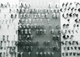 A display of various types of keys and locks arranged neatly on a wooden surface.
