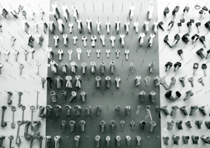 A set of freshly cut keys hanging neatly on a display board.