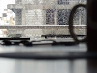 Close-up of a sleek window frame with raindrops on the glass, highlighting quality craftsmanship.