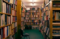 The school library filled with colorful books and students reading quietly in cozy corners.
