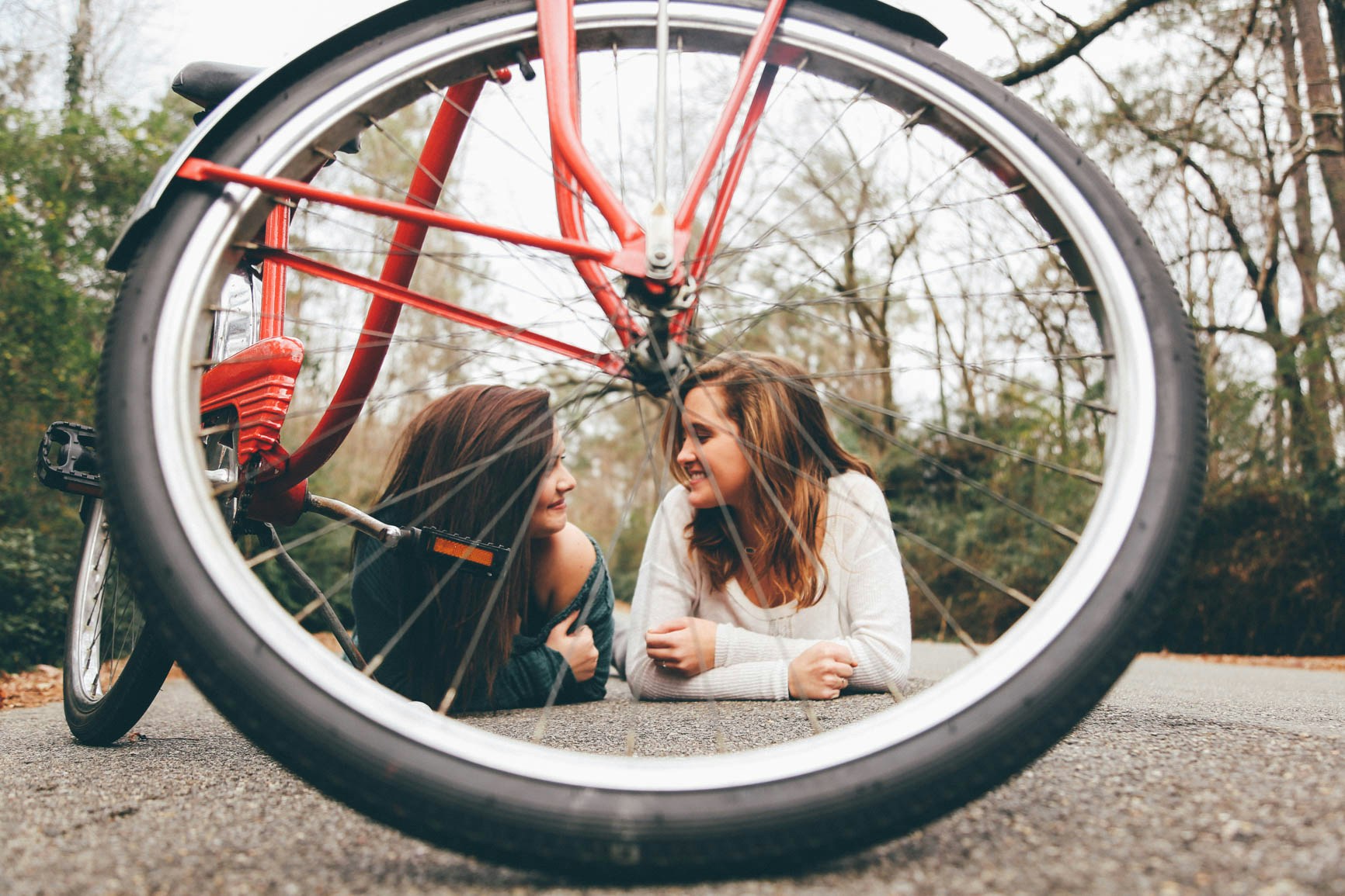 Smiling girls and a bike