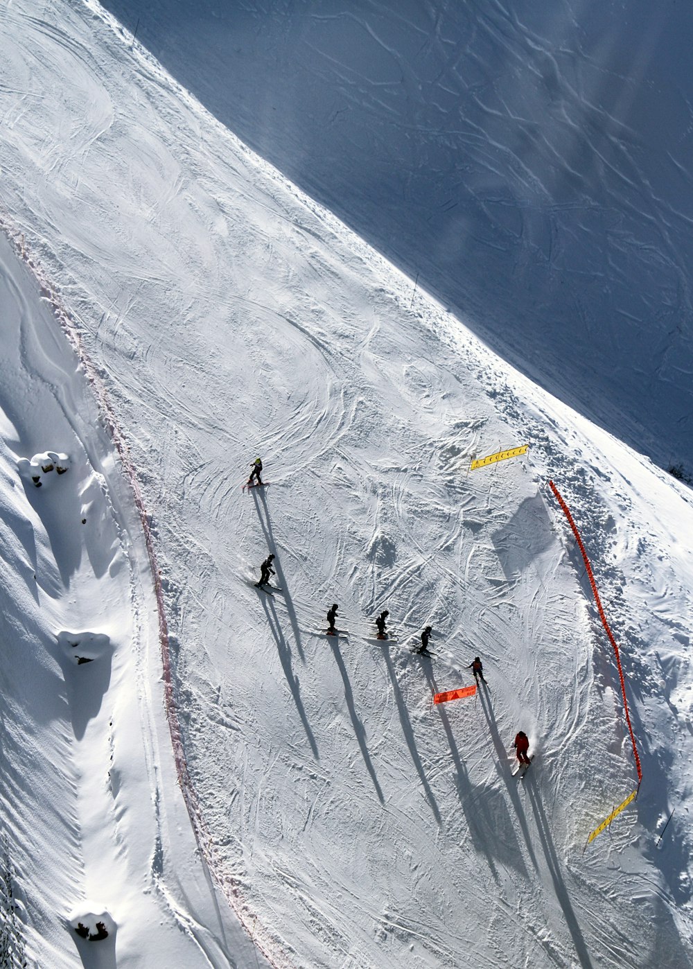 top view of people skating on snow