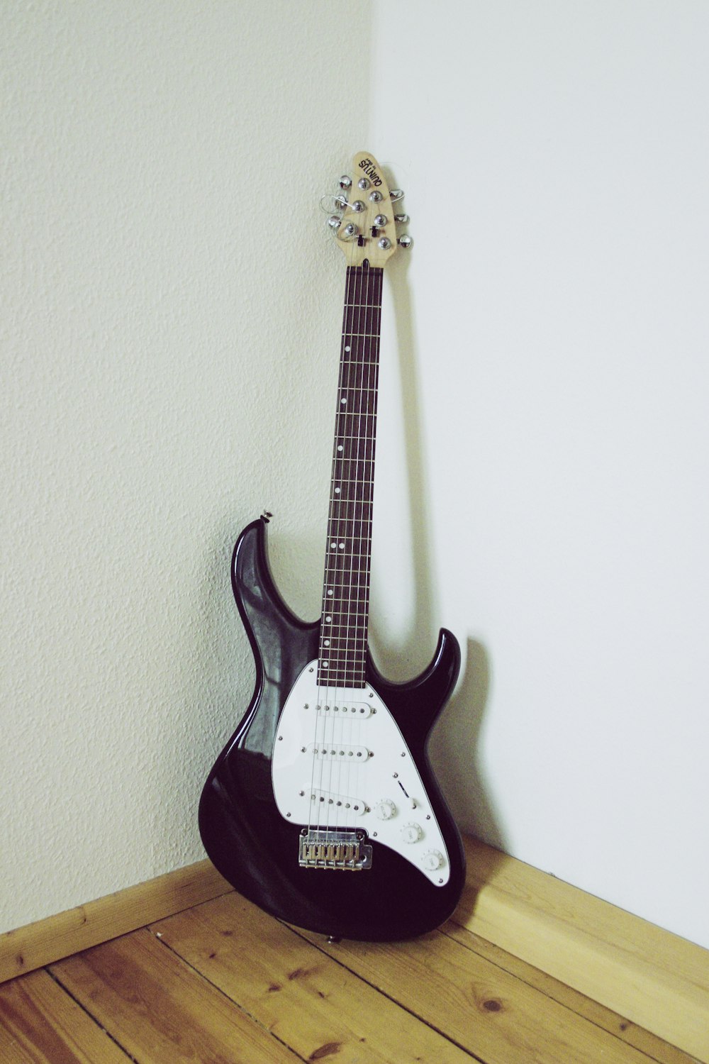 black and white stratocaster electric guitar