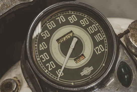 black and white analog gauge displaying 10