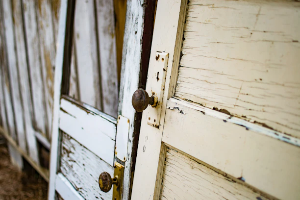A close-up of elegant wooden doors stacked neatly in a warehouse.