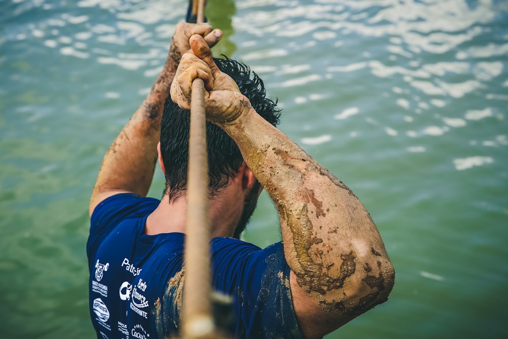 man moving across rope bridge