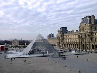 glass structure beside brown building