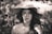 grayscale photography of woman wearing sun hat