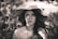 grayscale photography of woman wearing sun hat