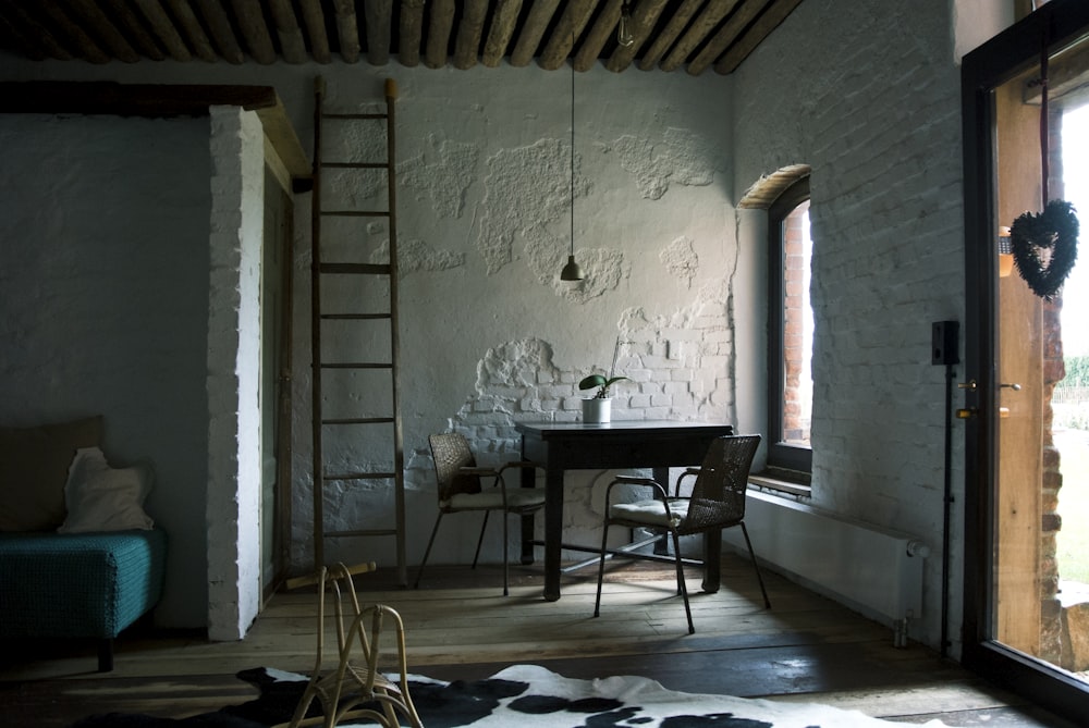 black wooden table and chairs