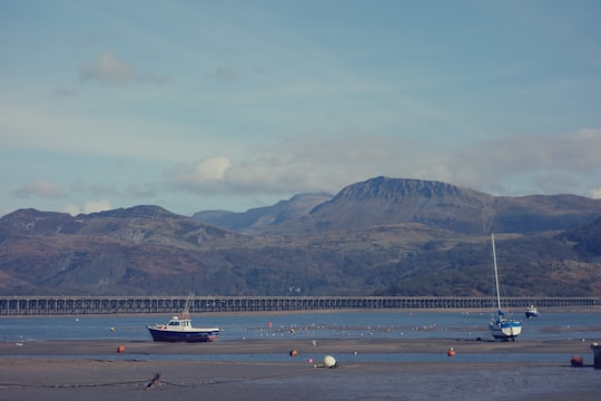 two white sailing boats near gray mountain in Barmouth United Kingdom