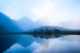 Group meditating beside a serene lake during the Australian camp trek.
