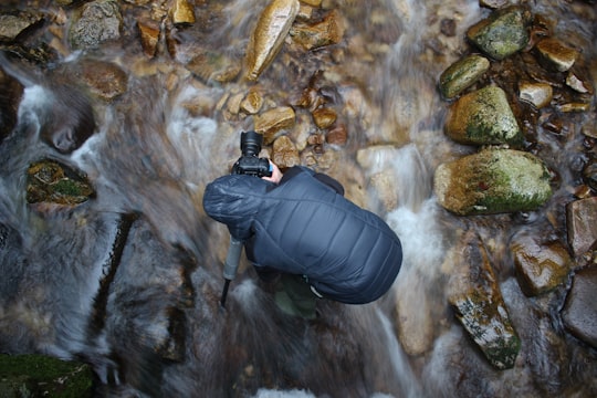 man standing on stream in Black Forest Germany