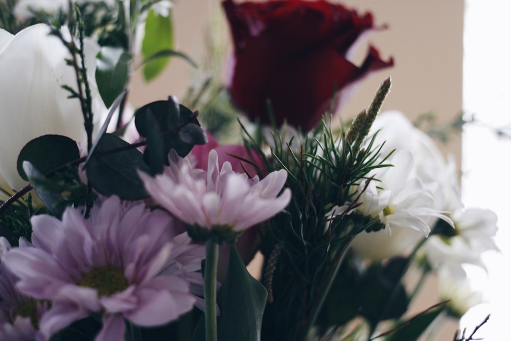 a bunch of flowers that are in a vase