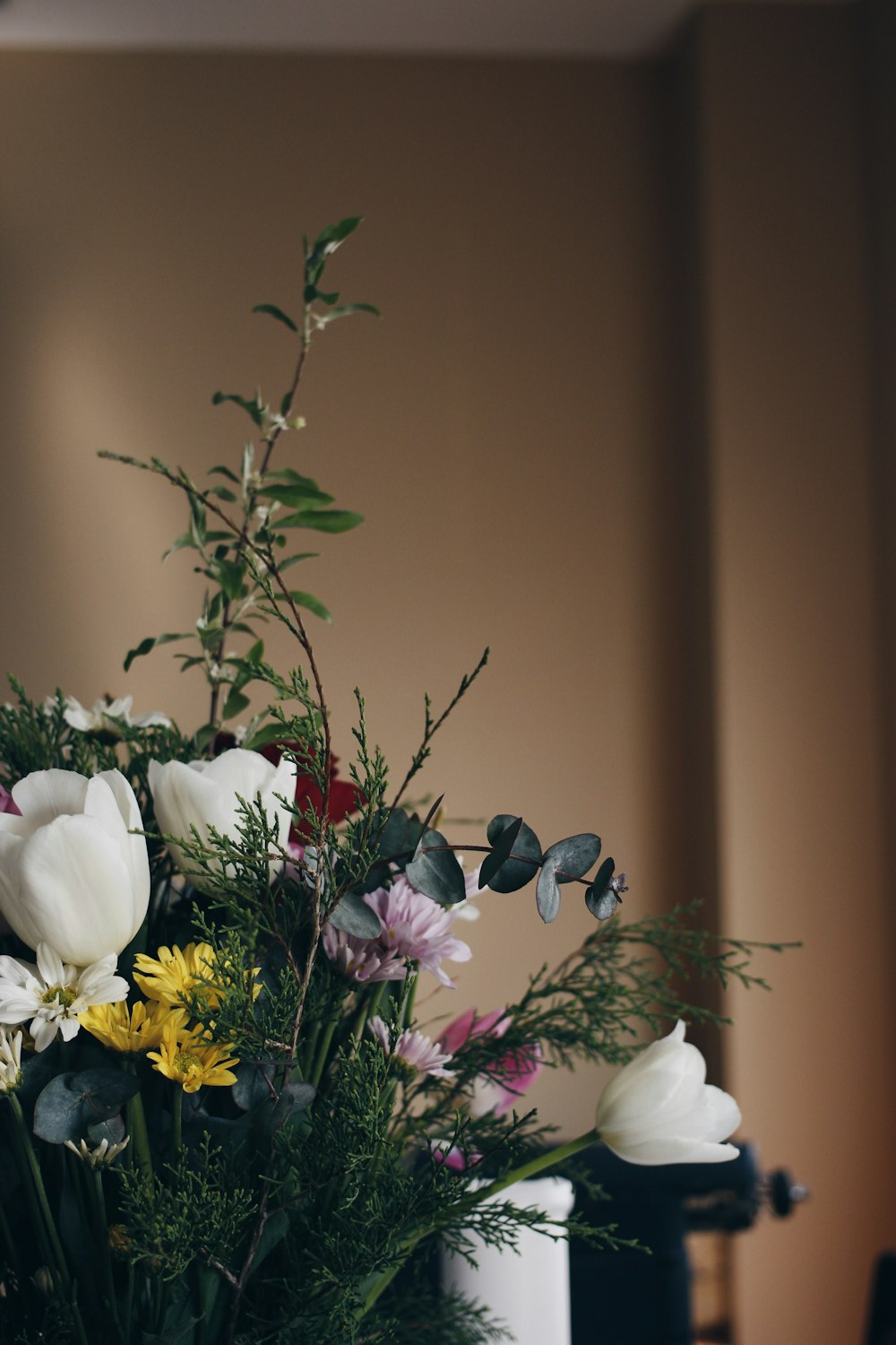 a bouquet of flowers in a vase on a table