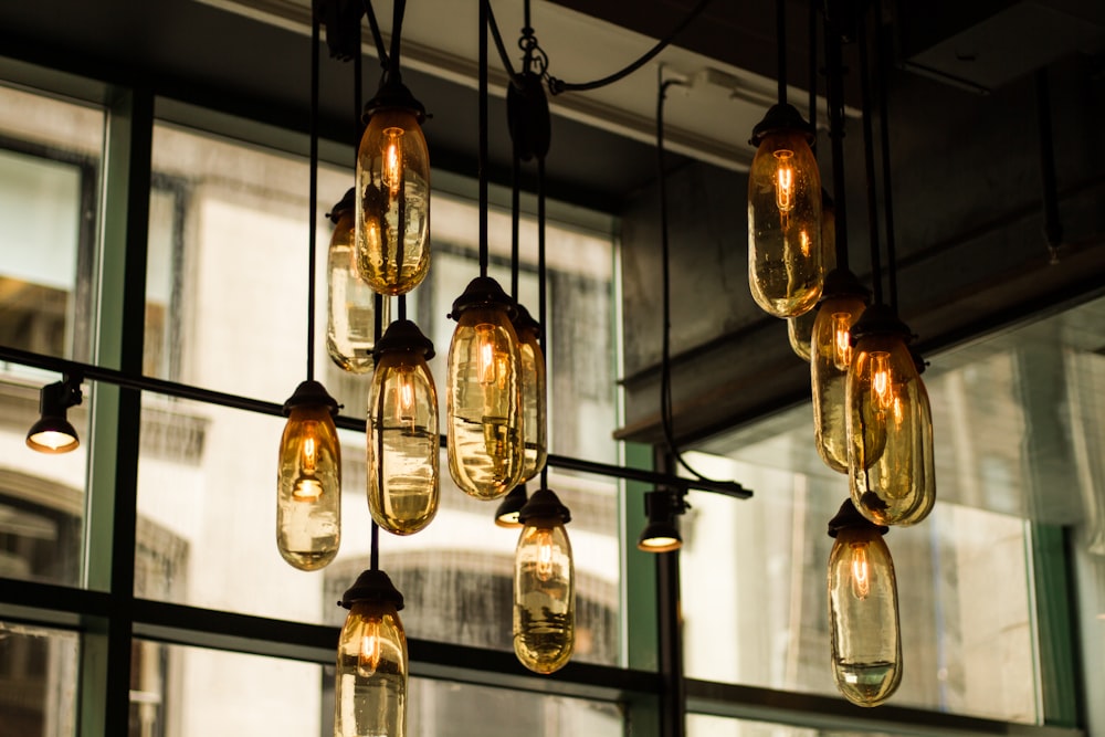 black pendant lamps with beige glass bulbs