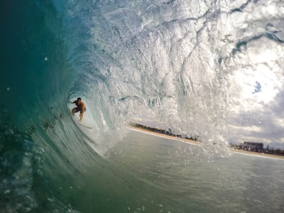 man surfing during daytime surfing google meet background