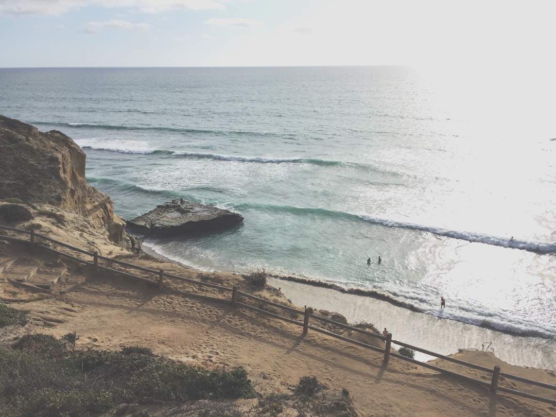 sea waves near rock formation,