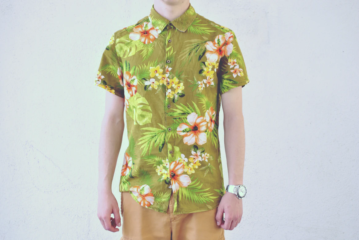 Colorful patterned Hawaiian shirt flat lay