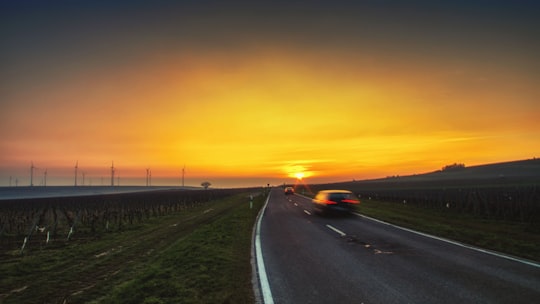 black car on road during sunset in Mölsheim Germany