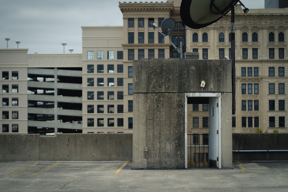 gray concrete house surrounded with buildings