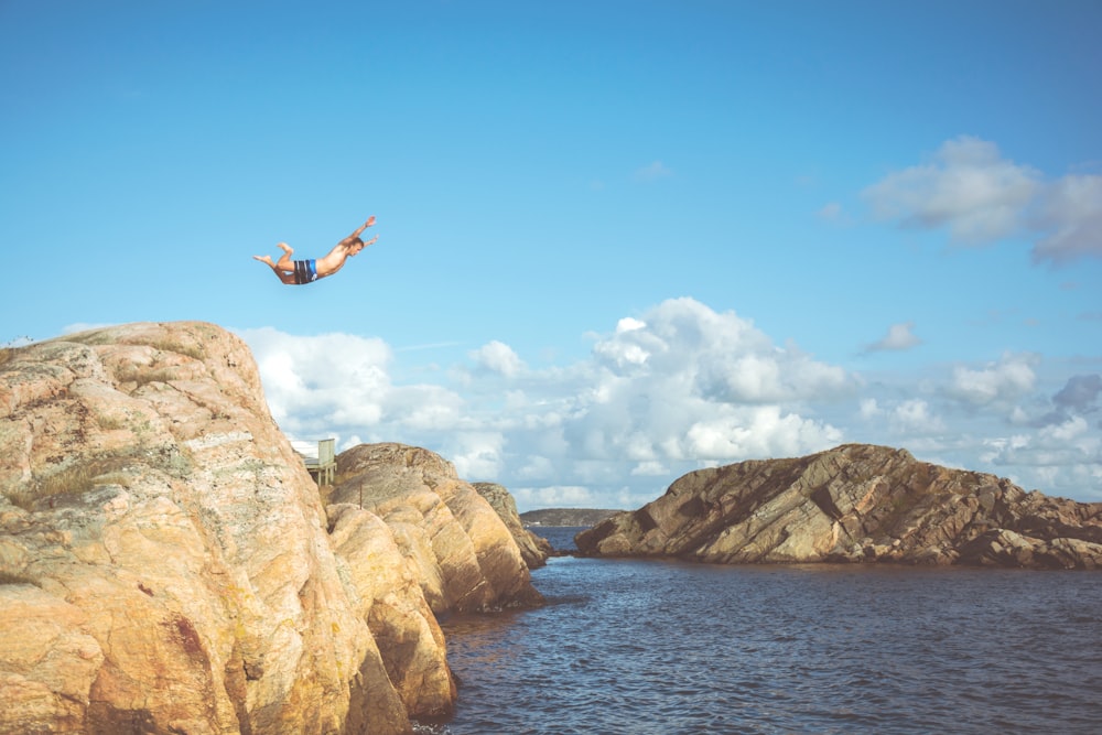 person diving in water