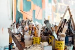 assorted-color paint brush on brown wooden table top