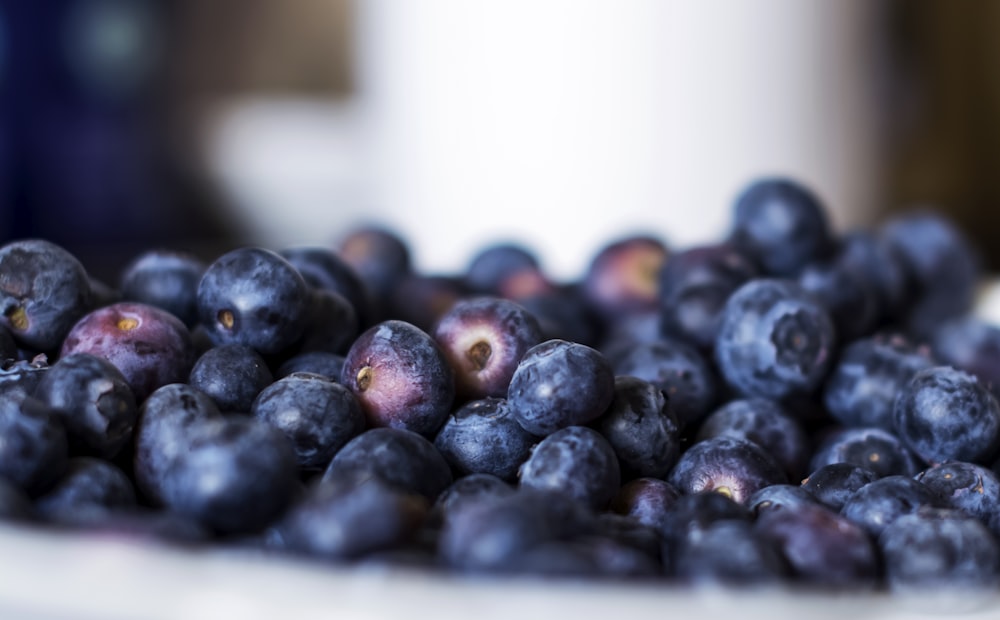 selective photography of blueberries