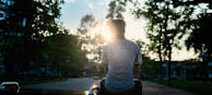 man sitting on road