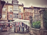 A quaint brocante market with antique treasures and locals browsing in the warm afternoon light