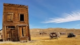 brown 2-storey house near wagon