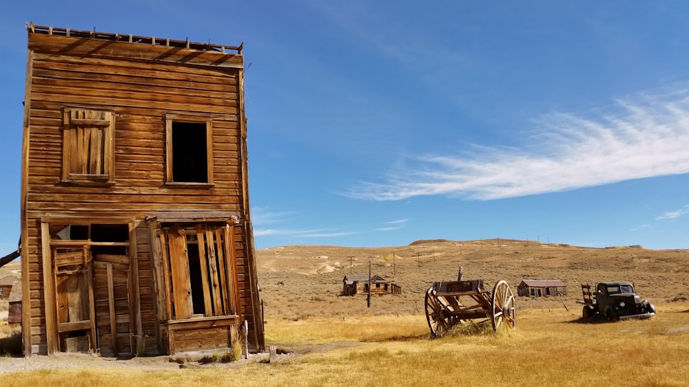 brown 2-storey house near wagon