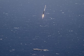 aircraft carrier and missile launching during daytime