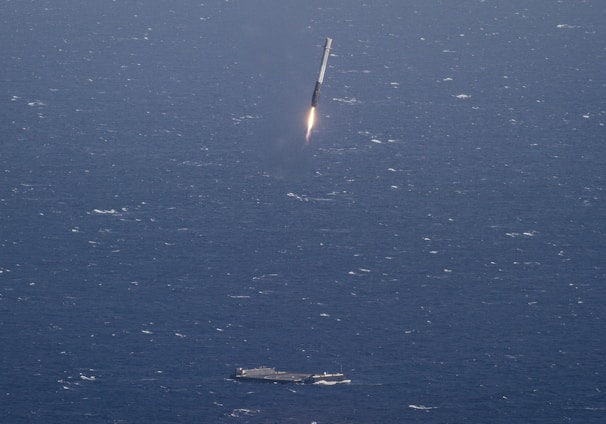 aircraft carrier and missile launching during daytime