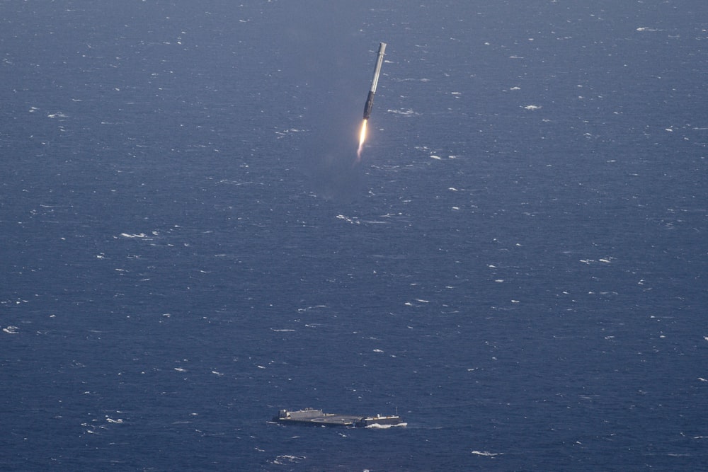 aircraft carrier and missile launching during daytime