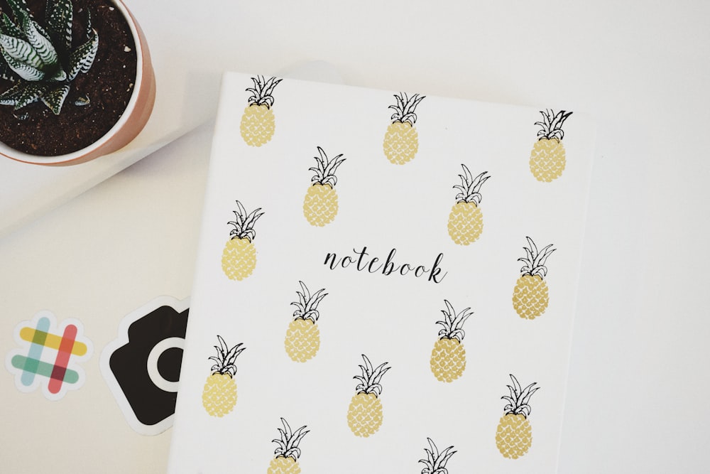 yellow pineapples covered notebook