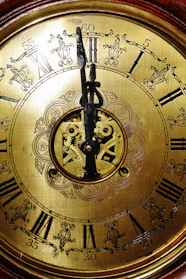Close-up of an elegant antique clock with intricate details.