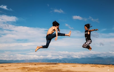 man and woman hanging on blue and white sky south island zoom background