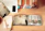 A cozy workspace with a tablet displaying colorful animal illustrations, alongside a cup of tea and sketchpads.