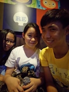 Nelson, Chucho, and Sara smiling together after a live performance.