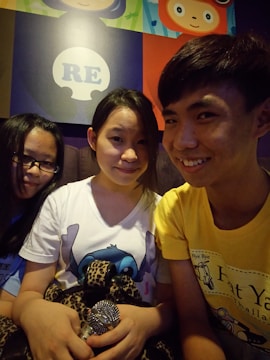 Nelson, Chucho, and Sara smiling together after a live performance.