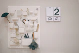 Well-organized cleaning supplies and schedule board for rental property maintenance