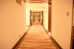 Hallway view showing neat and well-maintained shared spaces connecting private bedrooms